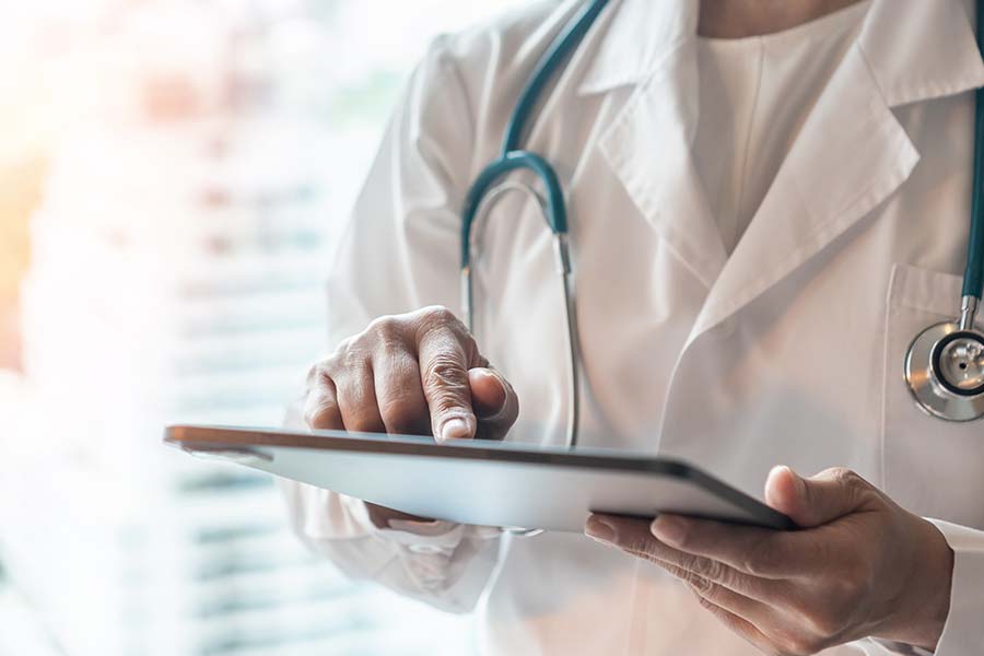 A doctor using a tablet