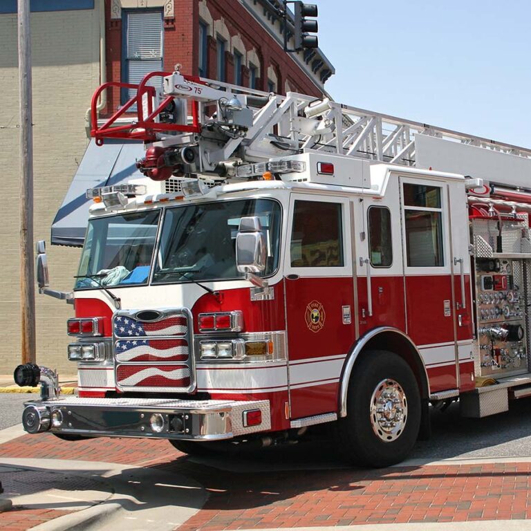 ladder fire truck with view of front and driver's side