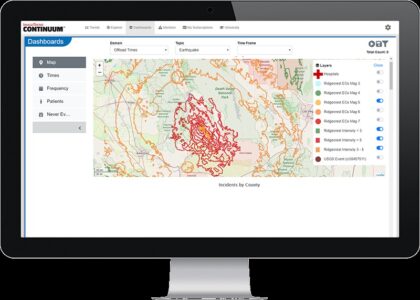 Computer monitor displaying a geographic map with earthquake data, including incident layers and frequency information.