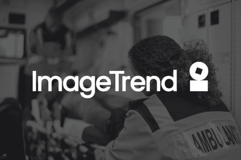 A paramedic tends to a patient inside an ambulance. The ImageTrend logo is prominently displayed over the scene.