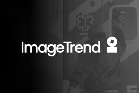 A person opens the rear door of an ambulance; the ImageTrend logo and name are prominently displayed in the foreground.