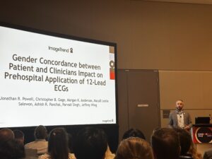 A presenter at an EMS World Expo session discusses NERIS data, with a slide titled “Gender Concordance between Patient and Clinicians Impact on Prehospital Application of 12-Lead ECGs.”
